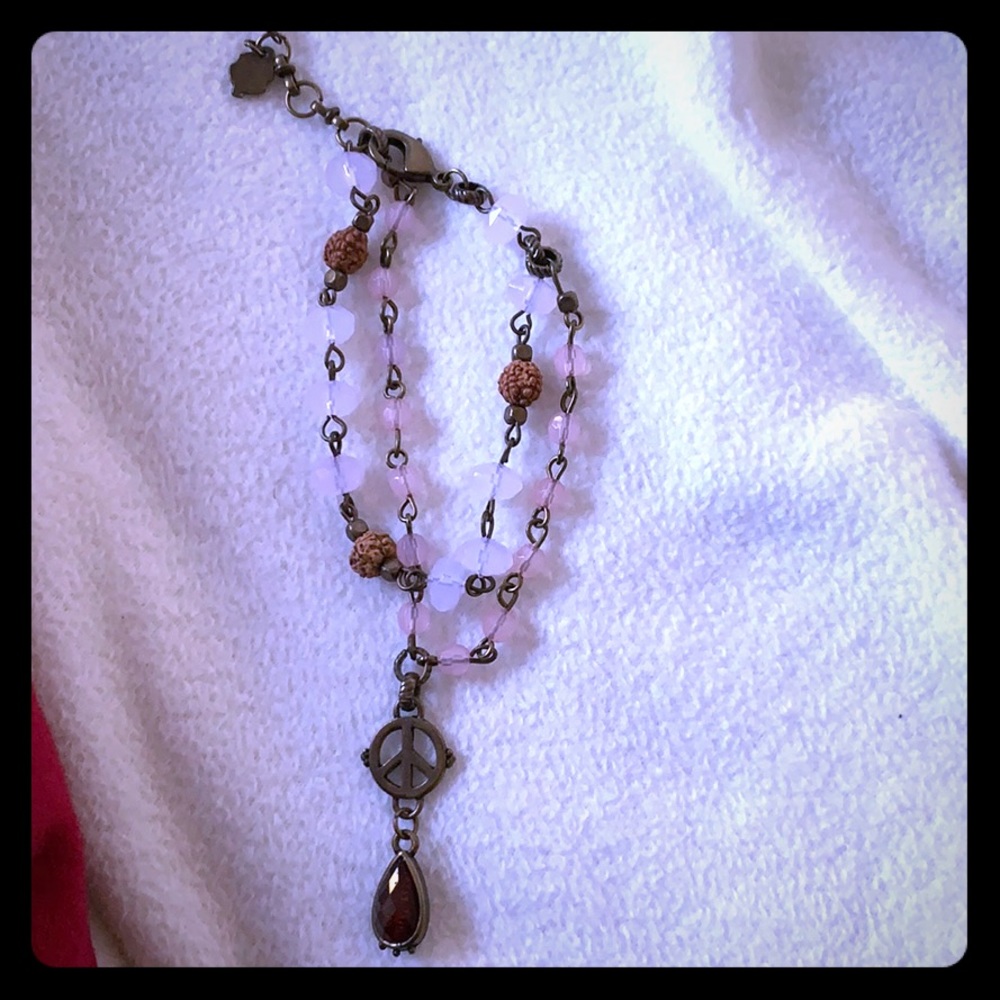 Cute beaded bracelet with peace sign detail